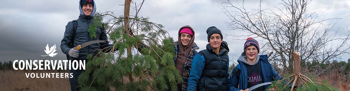 Volunteers with trees at Hazel Bird Nature Reserve, Ontario. Photo by Chelsea Marcantonio (NCC staff)