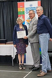Heather and Steve Mazurak, on behalf of Last Mountain Neighbours: Across the Fence for Common Sense, are being presented with the Regional Centre of Expertise on Education for Sustainable Development Award by the Lieutenant Governor of Saskatchewan, the Honourable Russ Mirasty (Provided)