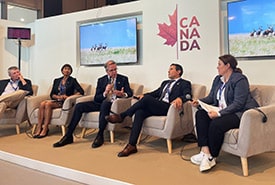 Rob Wilson and other panelists at the Grasslands and Canadian Livestock: Solutions from the Ground Up event at COP28 (Photo Melanie Bos/NCC)
